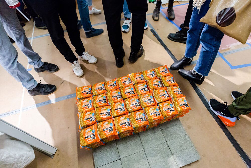 A close up of visitors feet around Sable Elyse Smith's work on the floor., Photo: Liz Ligon