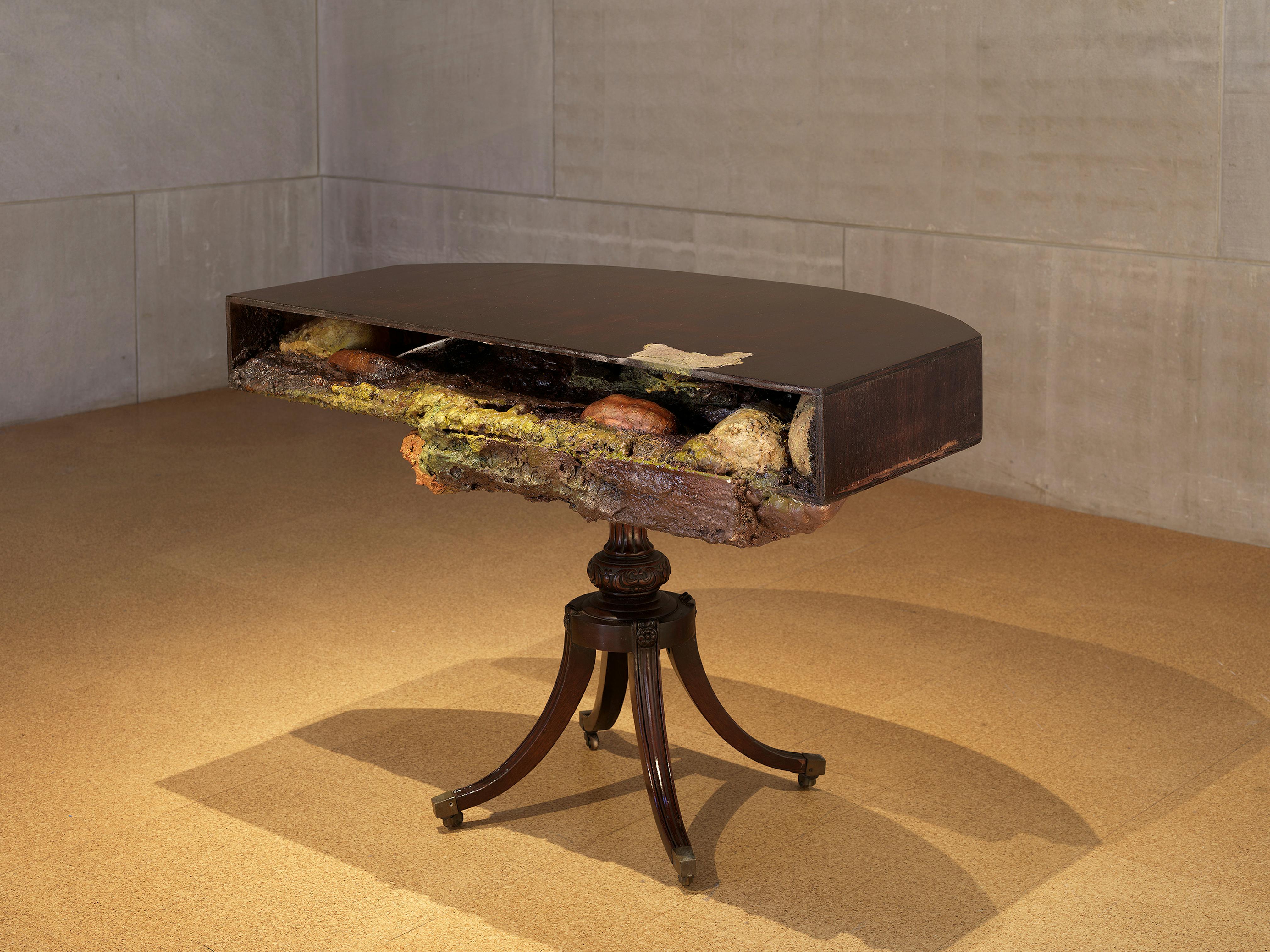 <p>Brandon Ndife</p>
<p><em>A Master's Tools</em><br />2022<br />Cast insulation foam, aquaresin, resin, soil, glue, wood, enamel paint, oil paint, ceramic plates, forks, various hardware<br />35 x 28 x 37 in.<br />Studio Museum in Harlem; gift of Burton Aaron<br />2023.22.2</p>