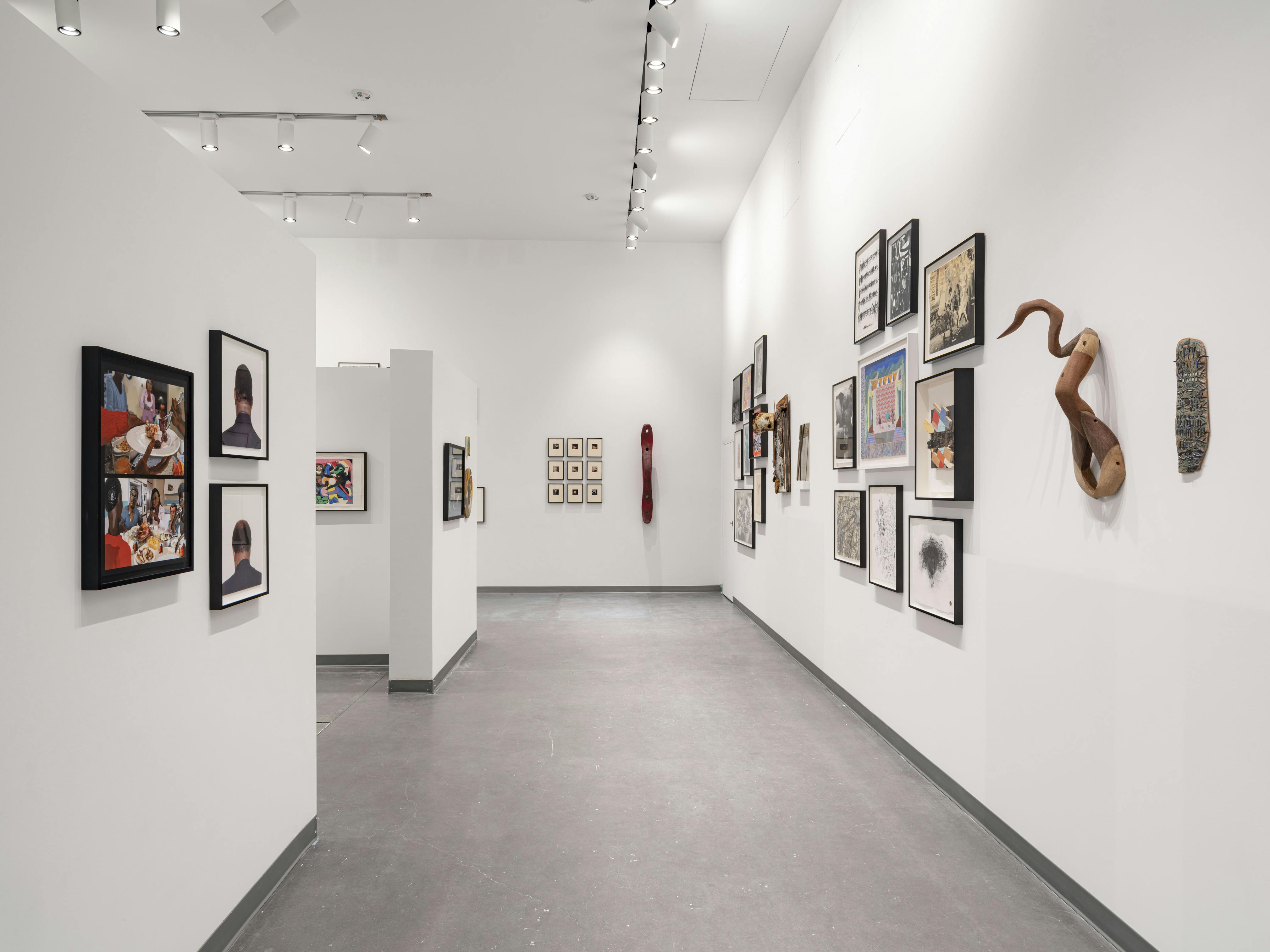 Installation view of artwork hanging on white walls