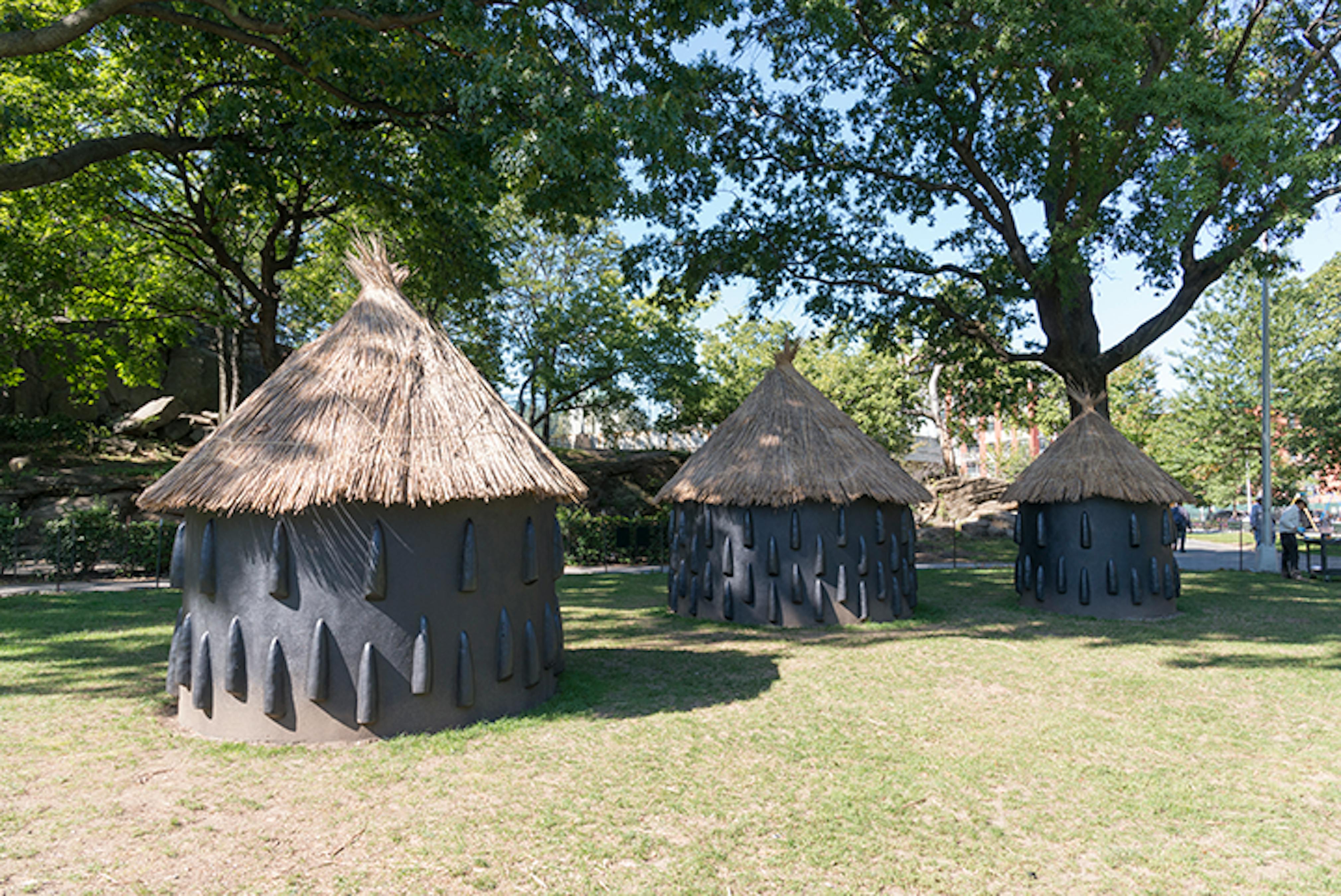 A particularly elaborate imba yokubikira, or kitchen house, stands locked up while its owners live in diaspora (Installation View), 2016. 
Marcus Garvey Park, New York, NY, August 25, 2016–July 25, 2017. 
Photo: Adam Reich