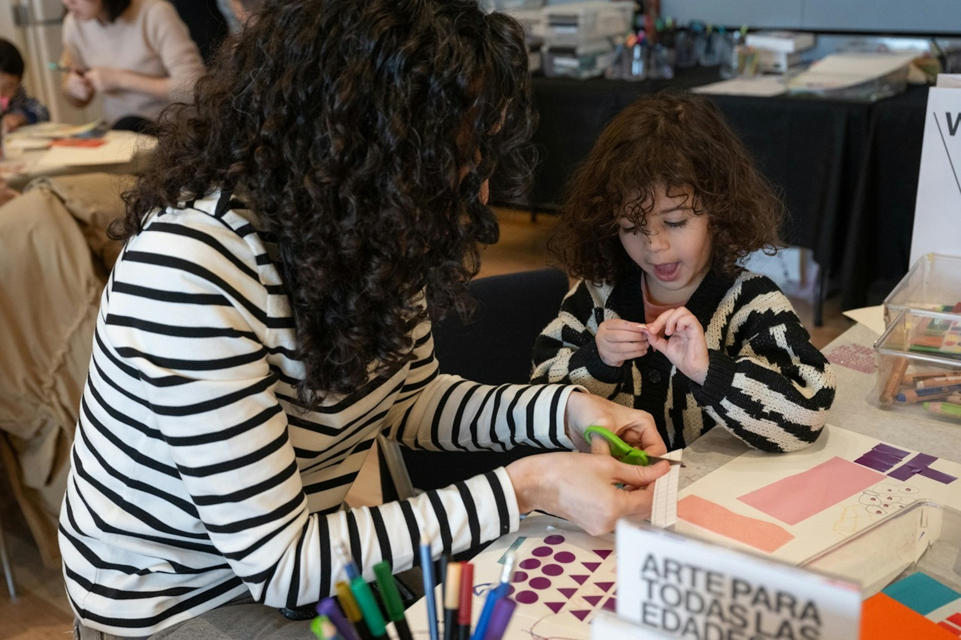 <p>Family making art on a Second Sunday, January 2024. Photograph by Filip Wolak.</p>