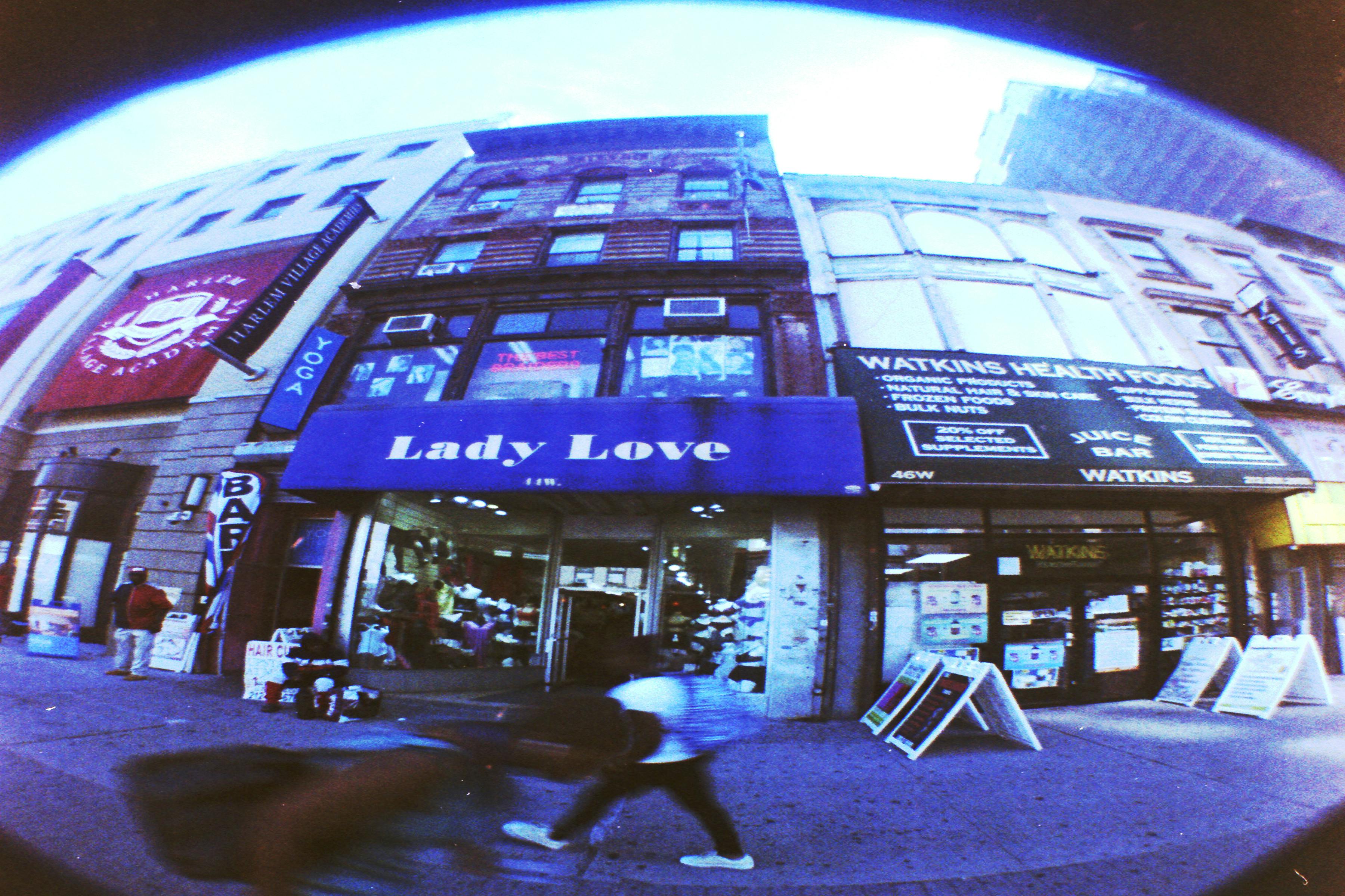 <p>Alex Harsley, <em>Fishing for Spiffy on 125TH</em>, 2019. Chromogenic color print, 16 × 20 in. Studio Museum in Harlem; Harlem Postcards Collection HPC.2019.3.1</p>