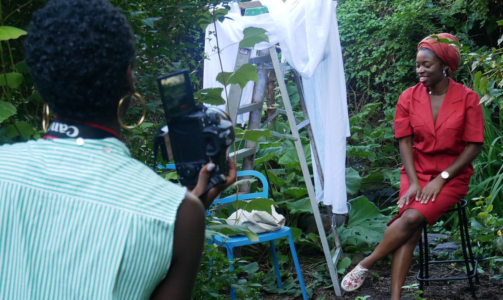The Laundromat Project Create Change Fellow Arielle Knight takes a photo of a visitor to the Joseph Daniel Wilson Memorial Garden (Harlem) during their community workshop series “Cultivate Project Harmony.”