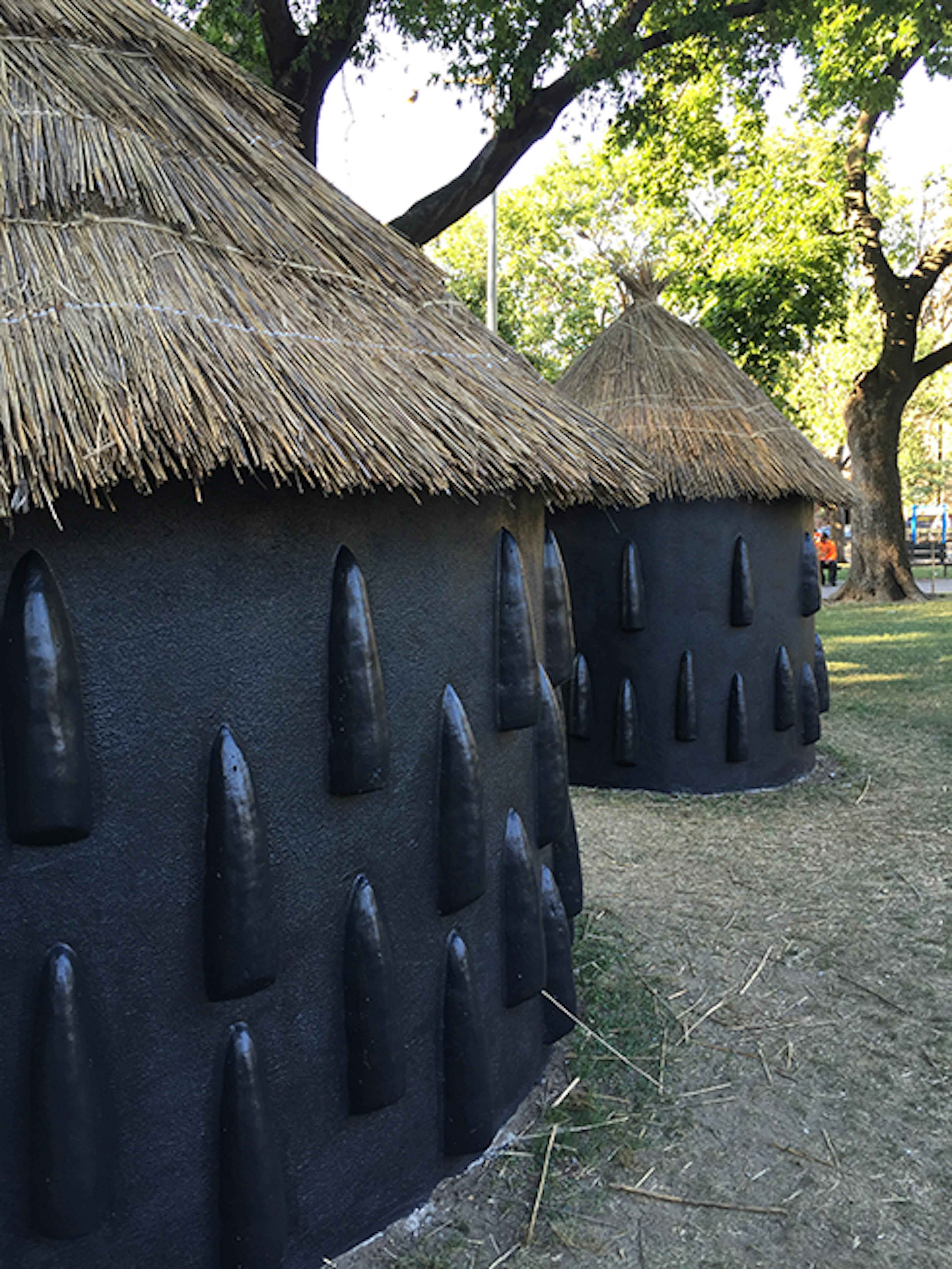 A particularly elaborate imba yokubikira, or kitchen house, stands locked up while its owners live in diaspora (Installation View), 2016. 
Marcus Garvey Park, New York, NY, August 25, 2016–July 25, 2017. 
Photo: Eric Booker