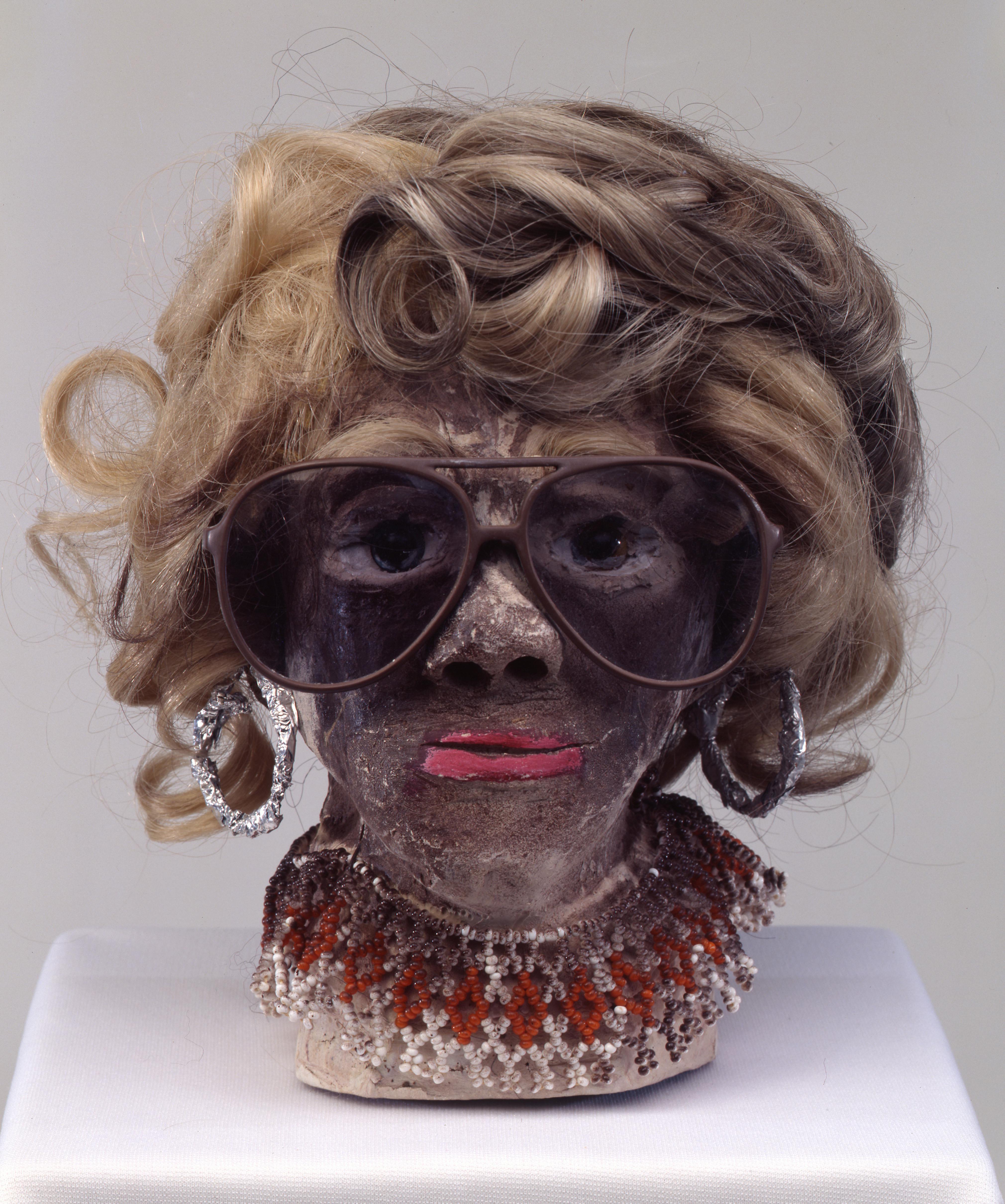 James “Son” Thomas
Untitled, 1987
Unfired clay, artificial hair, sunglasses, wire, aluminum foil, beads, glass marbles, paint, 9 1/2 × 8 × 8 3/4 in.
The William Arnett Collection of the Souls Grown Deep Foundation
Photo: Marc Bernier